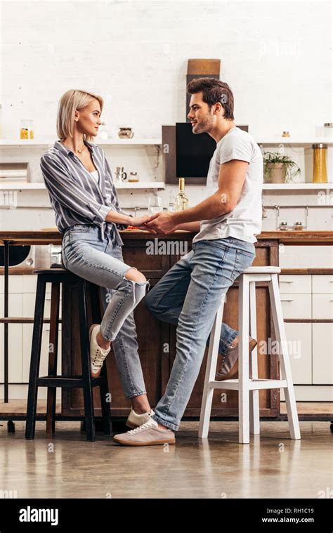 attractive girlfriend and handsome boyfriend holding hands Stock Photo ...