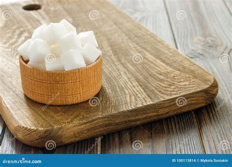 Sugar Cubes in Bowl on Wooden Table. White Sugar Cubes in Bowl Stock ...