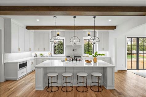 White Chef Kitchen With Wide Wood Beams | HGTV