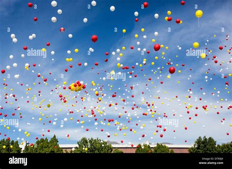 Helium balloons floating into the sky Stock Photo - Alamy