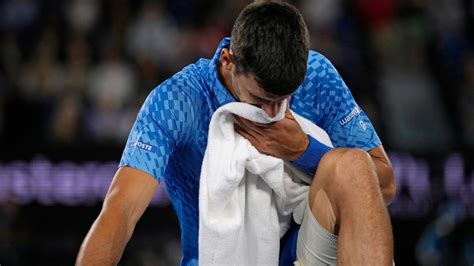 Novak Djokovic overcomes injury, heckler to advance in Melbourne - ESPN