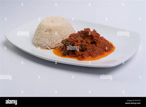 White rice and stew Stock Photo - Alamy