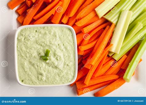 Top View of Green Dip with Carrots and Celery Stock Photo - Image of ...