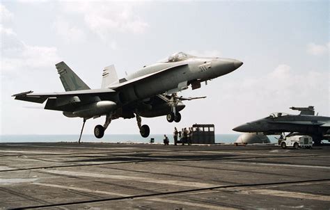 aircraft design - Why are the F/A-18 rudders deflected in opposing directions during takeoff ...