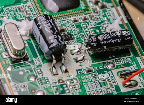 Capacitors, resistors and a crystal on a printed circuit board Stock Photo - Alamy