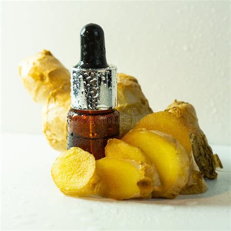Amber Glass Dropper Bottles and Ginger Root, Natural Cosmetics Concepts, Bottles with Oil or ...