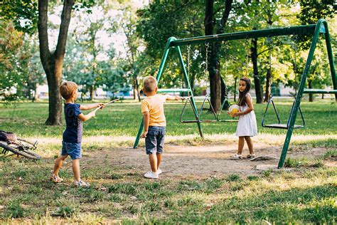 "Kids Playing At The Park" by Stocksy Contributor "Mosuno" - Stocksy