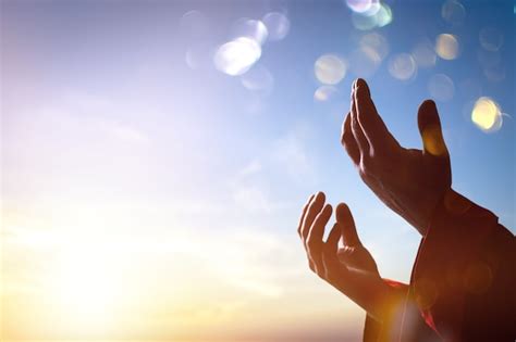 Premium Photo | Arab muslim man hands pray under sunrise light