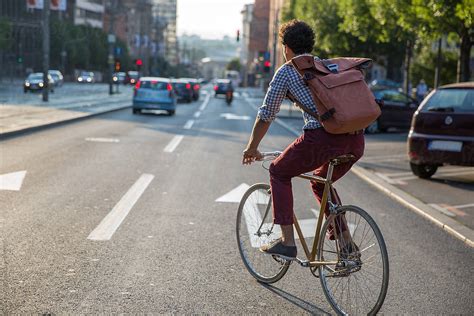 "Stylish Man Riding A Bike Outside To Work With Backpack" by Stocksy Contributor "Jovo Jovanovic ...