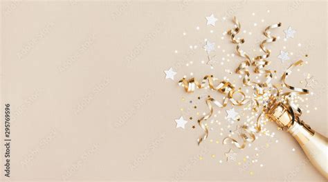 Celebration background with golden champagne bottle, confetti stars and ...