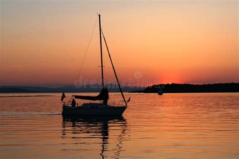 Boat Silhouette at Sunset stock photo. Image of glowing - 5357812