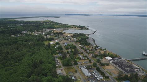 5K stock footage aerial video fly over riverfront homes to approach Hammond Marine in Warrenton ...