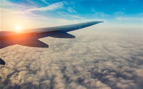 Wallpaper Passenger airplane, aircraft wing, sun, sky, clouds 2560x1600 Picture, Image