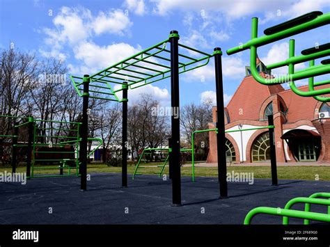 public outdoor exercise and sports park. green pull up bar and workout ...