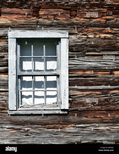 Detail of window in log cabin Stock Photo - Alamy