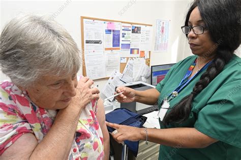 Patient receiving the 2023 Covid-19 vaccine - Stock Image - C058/6015 - Science Photo Library