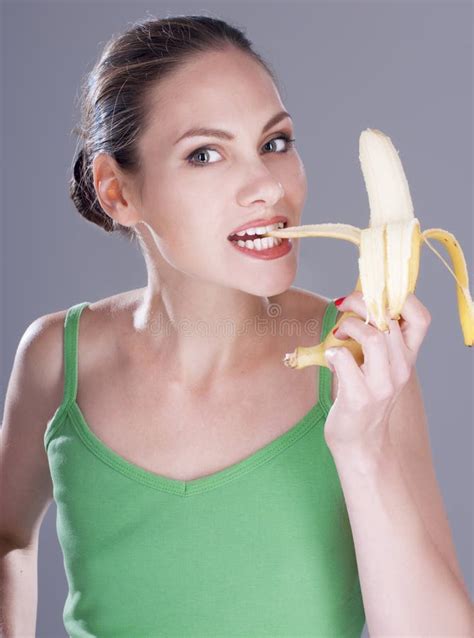 Charming Woman Eating a Banana. Stock Photo - Image of healthy, tropical: 45121996