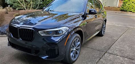 Took ownership of my first BMW. X5 45e. Carbon blackb metallic, cognac interior, shadowline trim ...