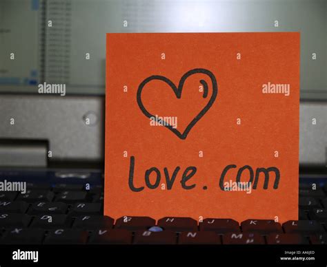 memo note on notebook drawing of heart love com Stock Photo - Alamy