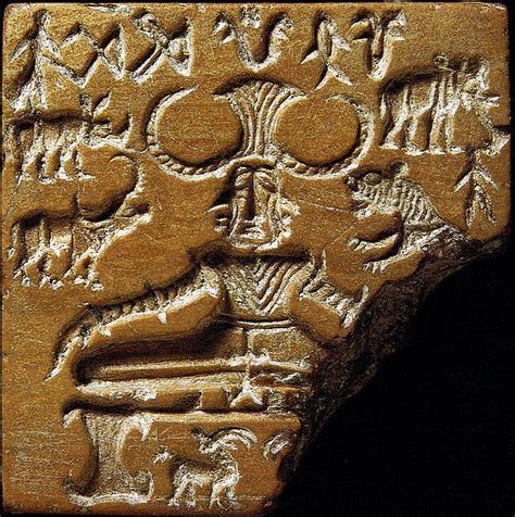 an ancient carving with animals and people on it's face is shown in ...