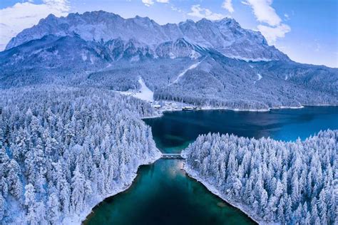 Eibsee a lake at the base of the Zugspitze Bavaria Germany | Zugspitze, Lake, Lakeside village