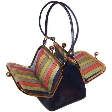 1960's Bonnie Cashin Double Kiss Lock Mini Leather Handbag With Stripe Interior at 1stdibs