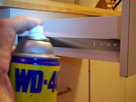 Fix my Cabinet » Spray WD-40 on Drawer Slides