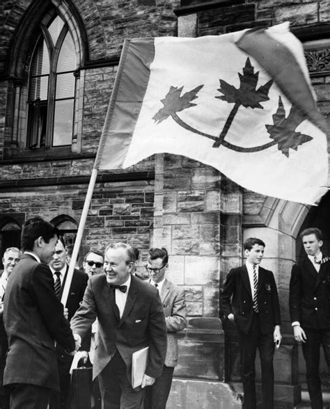 Prime Minister Lester B. Pearson shaking hands with University Student ...