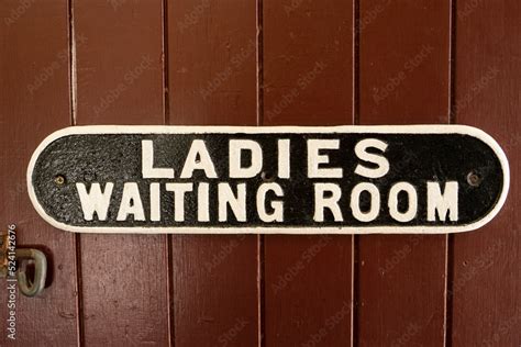 A vintage cast iron ladies waiting room sign at an old railway statioin ...