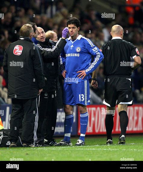 Chelseas michael ballack receives treatment for a facial injury hi-res stock photography and ...