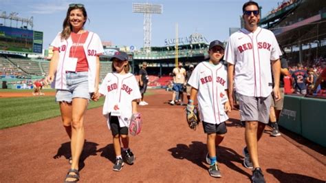 Flames AGM Chris Snow, who is battling ALS, threw the opening pitch at ...