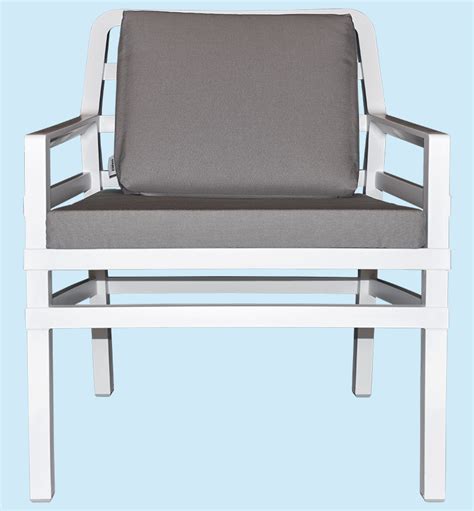 a white chair with grey cushions against a blue background