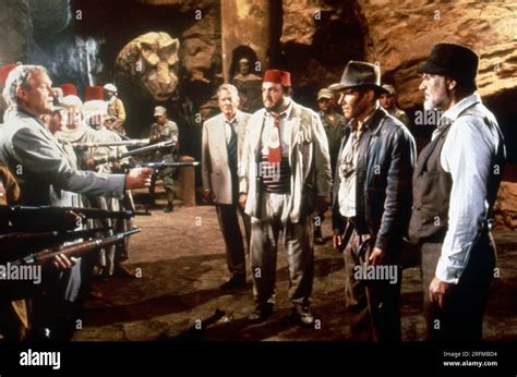 Indiana Jones and the Last Crusade Year : 1989 - USA Director : Steven Spielberg Julian Glover ...