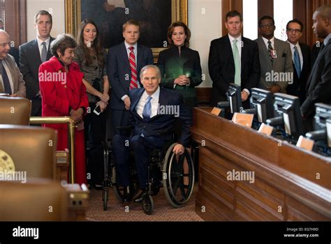 Texas Gov. Greg Abbott rolls his wheelchair toward dais in the Texas ...