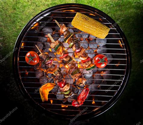 Barbecue grill with various kinds of meat. Stock Photo by ©Kesu01 102675910