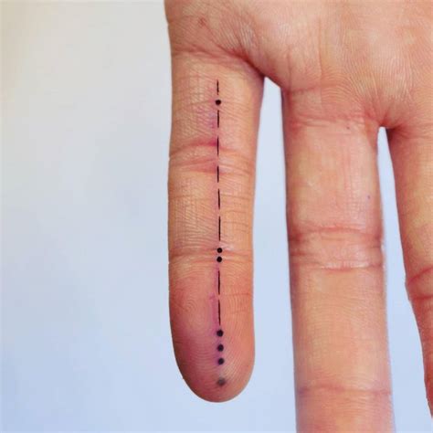 Morse code tattoo done on the finger.