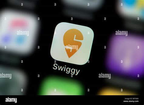 A close-up shot of the Swiggy app icon, as seen on the screen of a smart phone (Editorial use ...