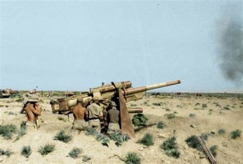 German FlaK 8,8cm guns firing at advancing British armor during the ...