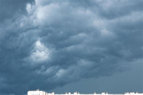 Heavy rain clouds over a city, dark blue clouds dramatic view of a sky ...