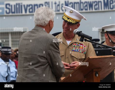 Graeme Day gives U.S. Marine Corps Maj. Gen. Eric M. Smith, commanding ...