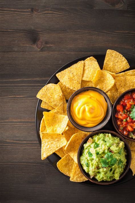 Mexican Nachos Tortilla Chips with Guacamole, Salsa and Cheese D Stock Photo - Image of green ...