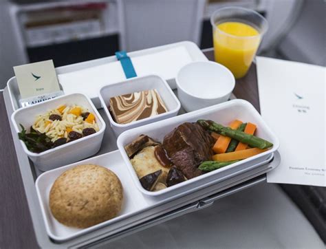 Airlines are bringing back inflight snacks and drinks. But should you eat on the plane? | The ...