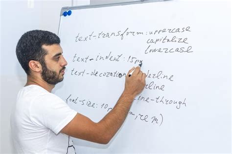 Premium Photo | Teacher in front of whiteboard the teacher writing on whiteboard