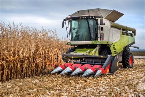 Premium Photo | Combine harvester working in a corn field during harvest