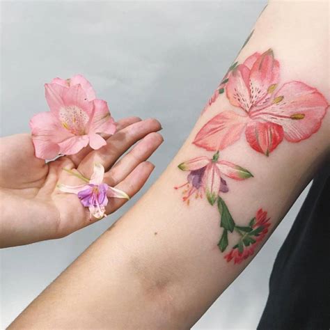 Alstroemeria, fuchsia and chrysanthemum tattoos on the