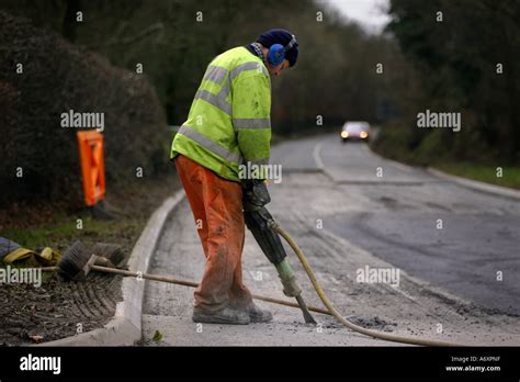 Road worker digging up tarmac Stock Photo, Royalty Free Image: 6666974 - Alamy