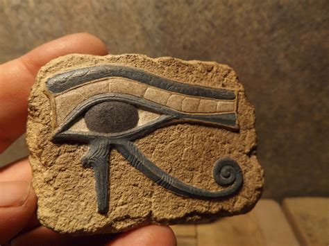 Egyptian Art - Eye of Horus and Ankh amulet. Ancient Egypt carving / Sculpture