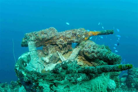 Haunting photos inside world’s largest underwater graveyard packed with ...