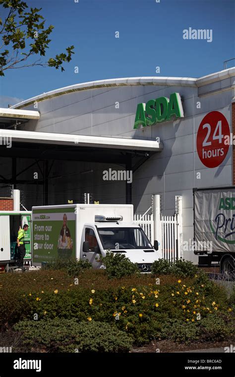 Asda home delivery vans loading up deliveries at Asda supermarket store ...