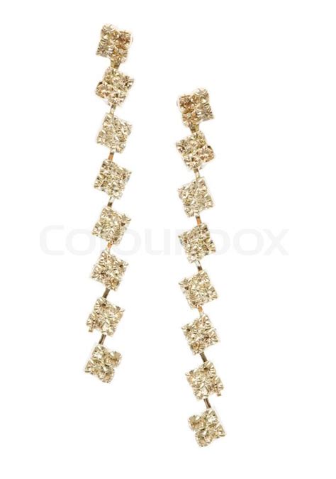 Pair of earrings isolated on the white ... | Stock image | Colourbox